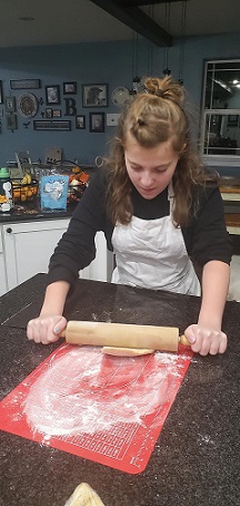 Pic of Alex rolling dough