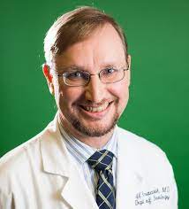 Pic of Jeff Kraakevik, MD with green background